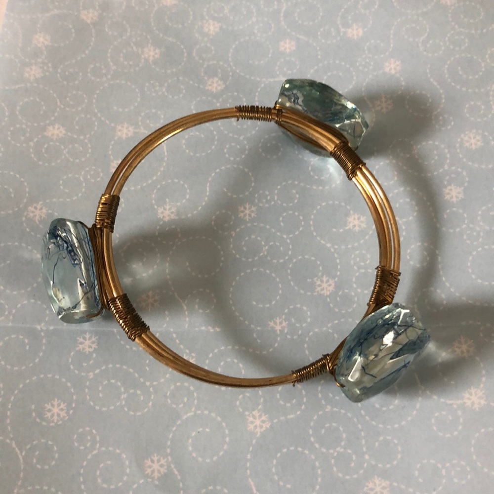Gold wire bangle with blue stones